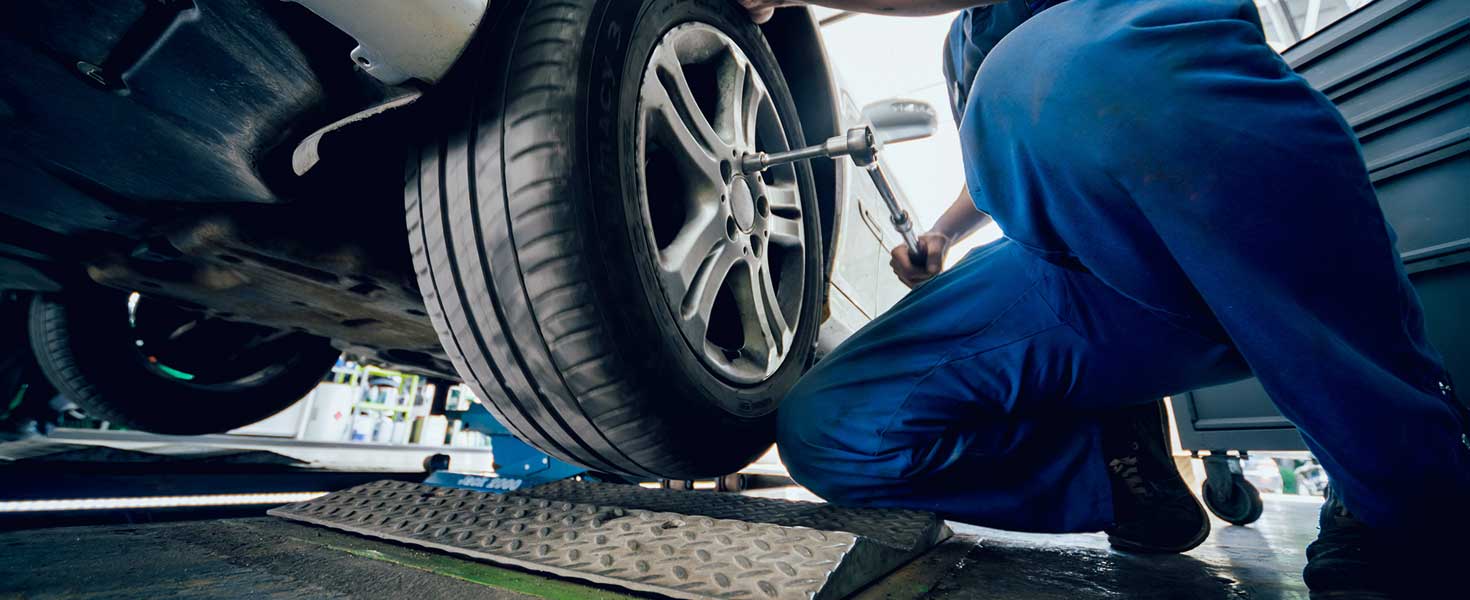 Automotive suspension test and brake test rolls in a auto repair service.
